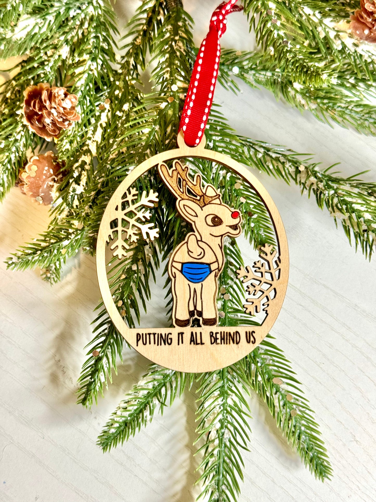 “Putting it all behind us” ornament